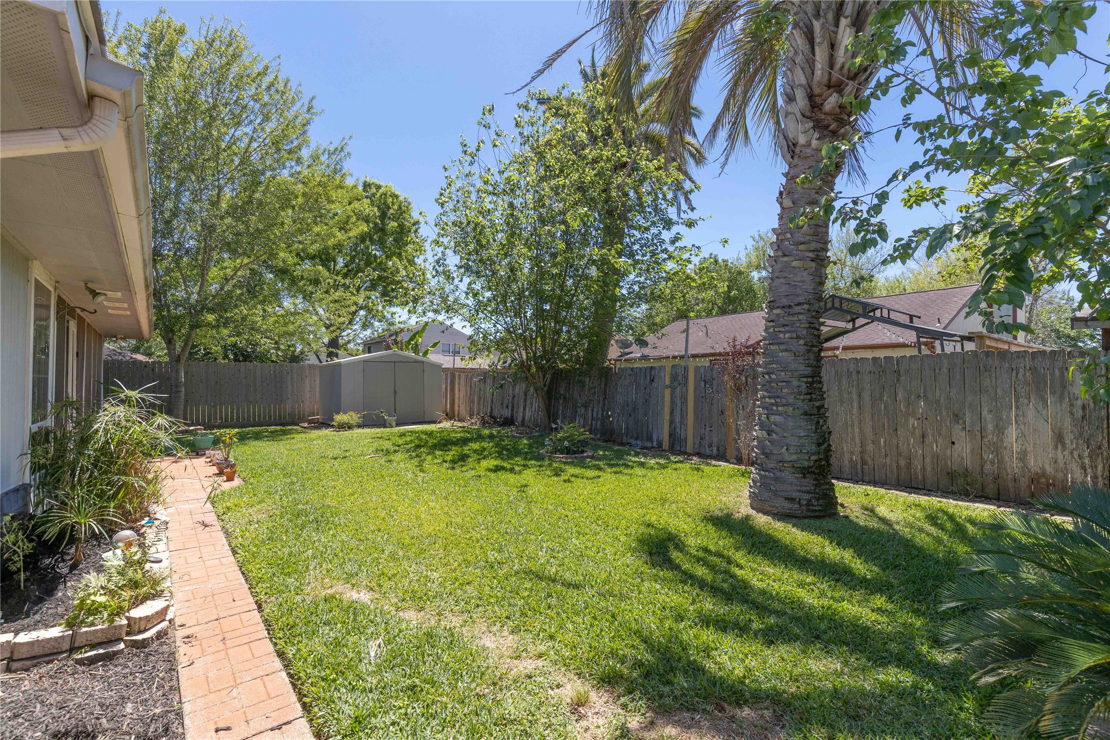 15730 Castorglen Drive Houston, TX 77598 - Photo 12 of 38 a view of garden with wooden fence