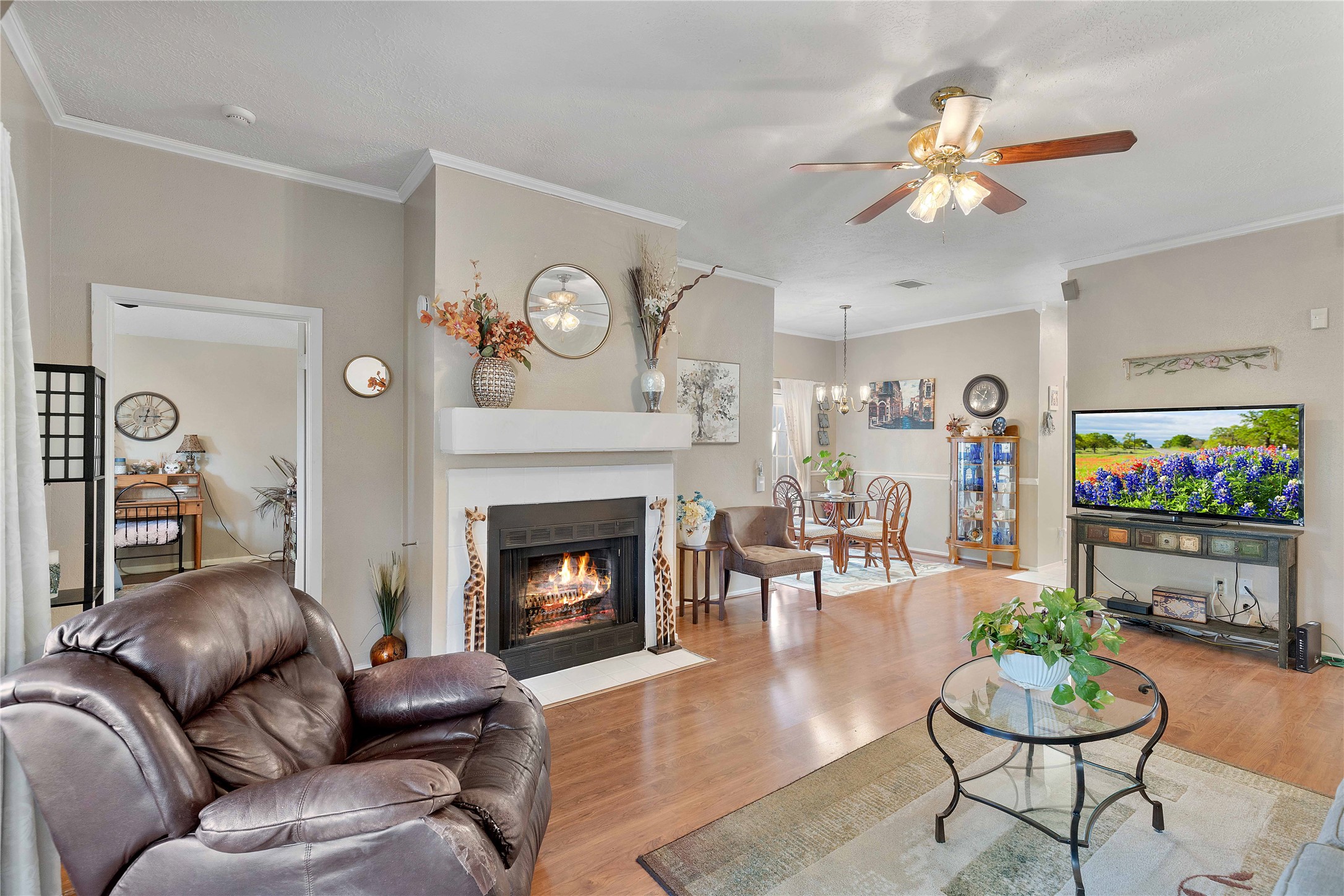 15730 Castorglen Drive Houston, TX 77598 - Photo 20 of 38 a living room with furniture and a fireplace