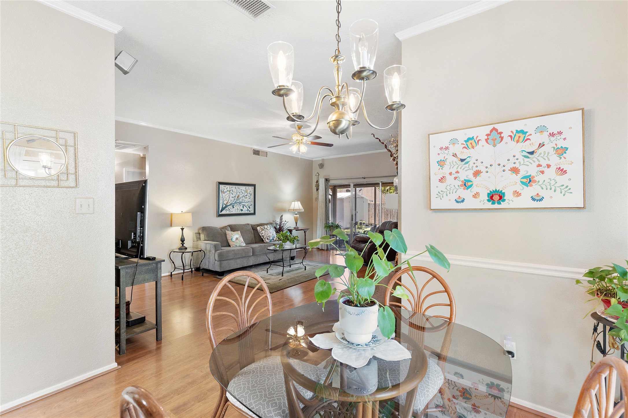 15730 Castorglen Drive Houston, TX 77598 - Photo 22 of 38 a dining room with furniture a rug and wooden floor