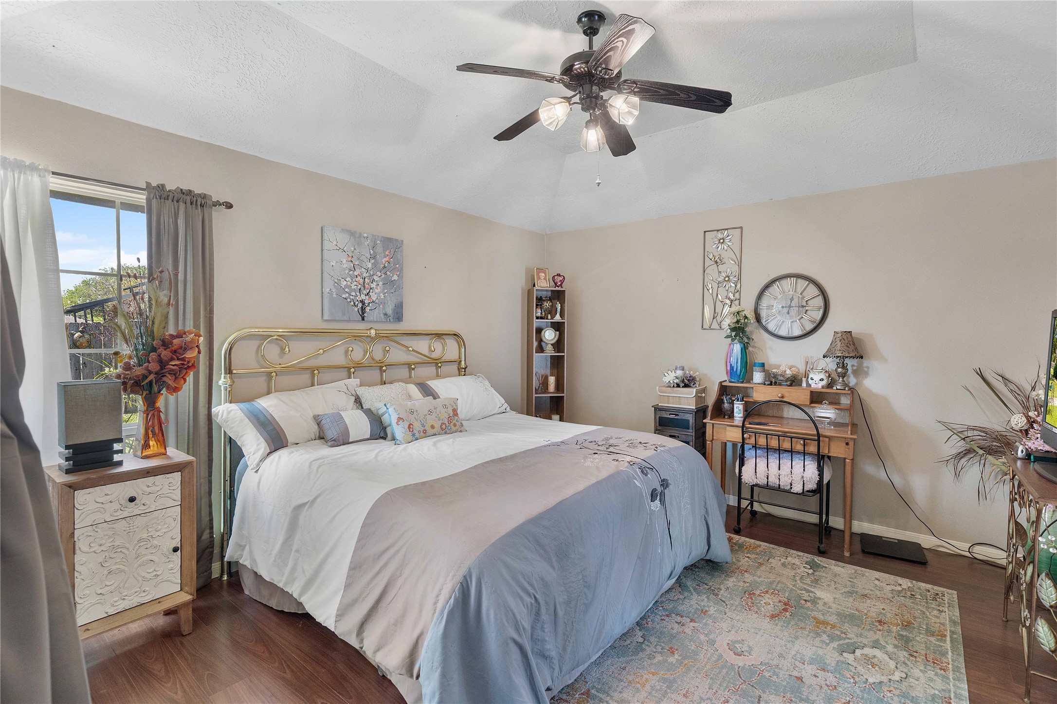15730 Castorglen Drive Houston, TX 77598 - Photo 27 of 38 a bedroom with a bed and a chandelier