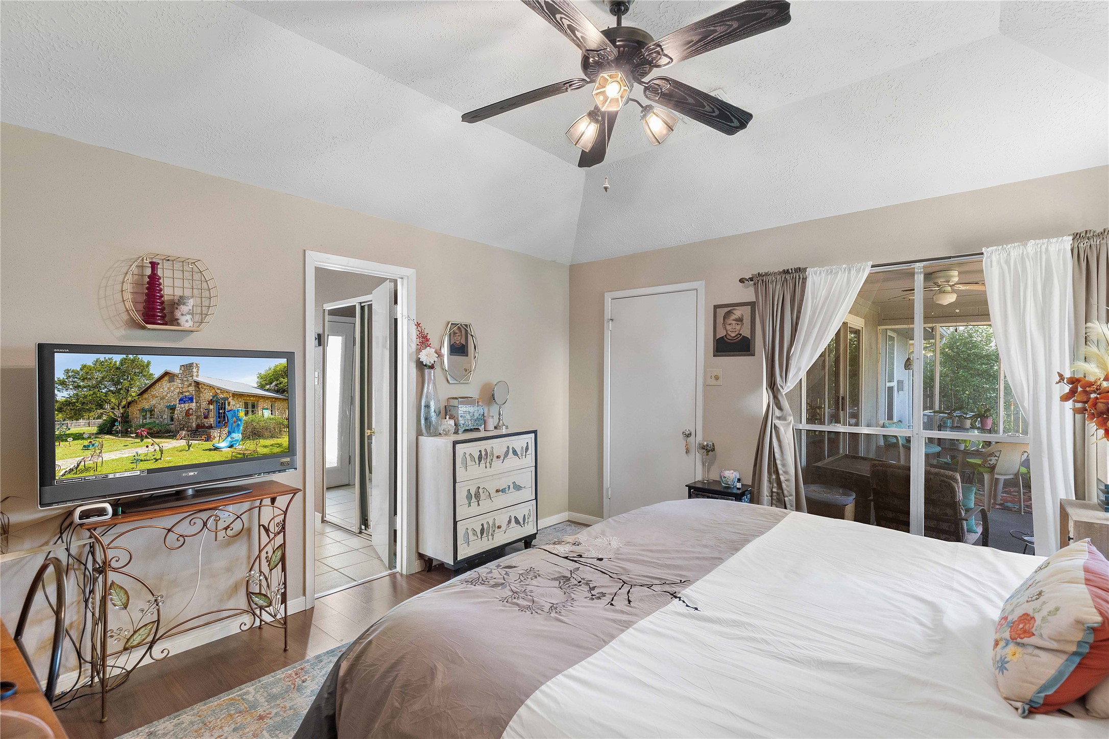 15730 Castorglen Drive Houston, TX 77598 - Photo 28 of 38 a bedroom with a bed and a flat screen tv in it