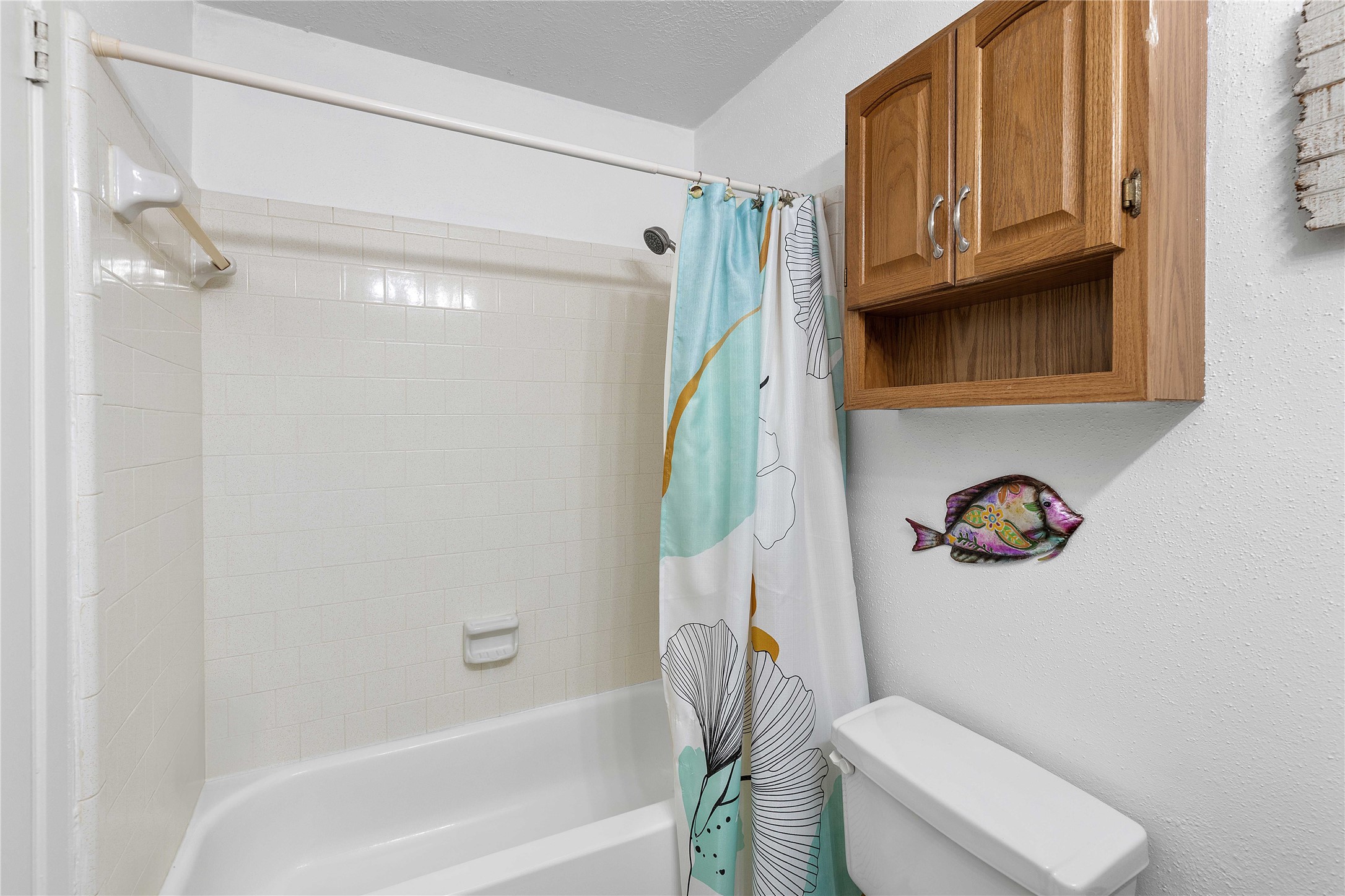 15730 Castorglen Drive Houston, TX 77598 - Photo 34 of 38 a bathroom with a toilet and a shower curtain