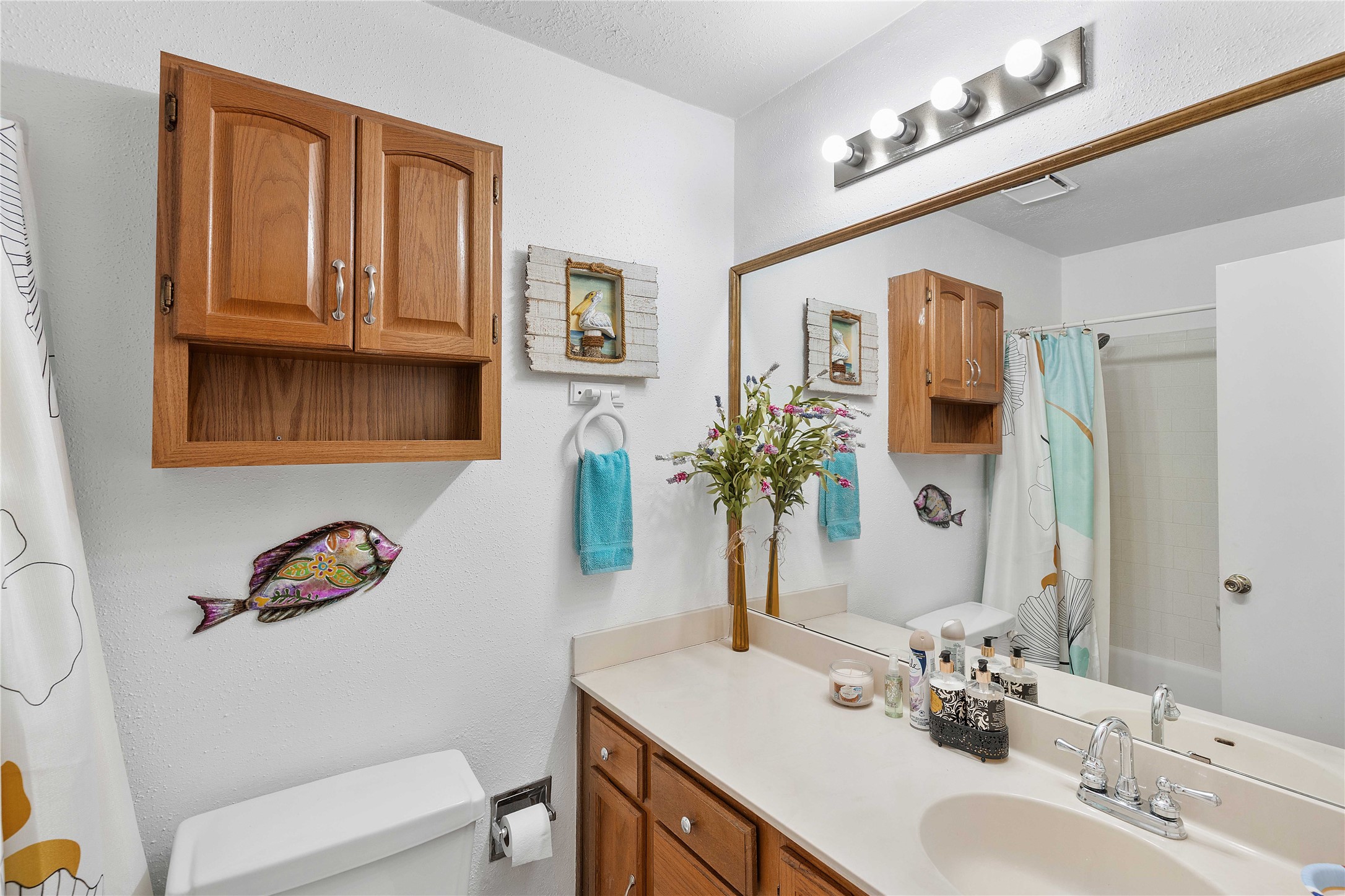 15730 Castorglen Drive Houston, TX 77598 - Photo 36 of 38 a bathroom with a sink a toilet and a mirror