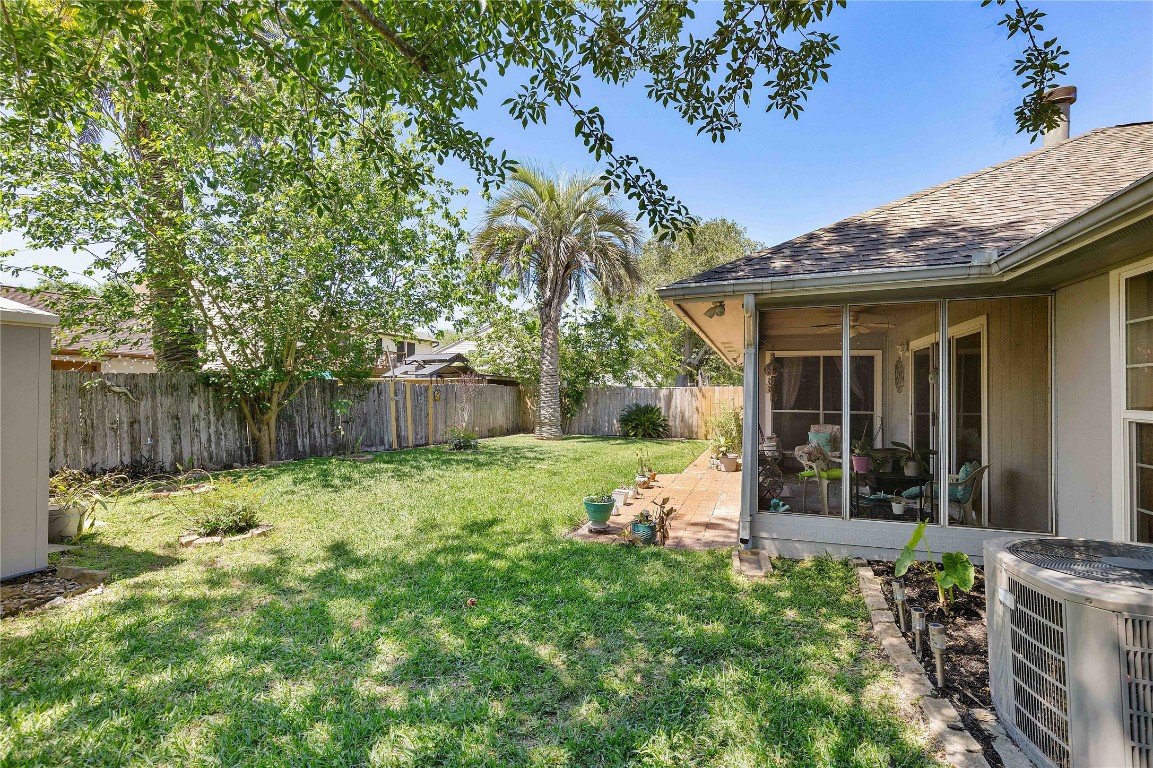 15730 Castorglen Drive Houston, TX 77598 - Photo 8 of 38 a view of a chair and table in backyard of the house