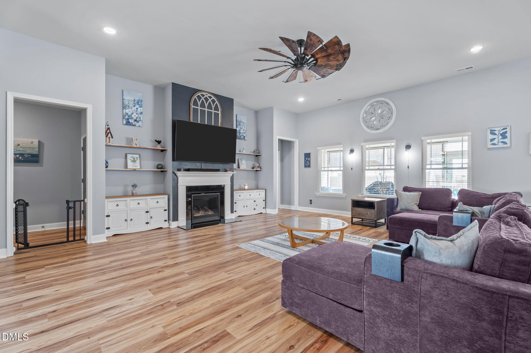 9405 Whitley Road Bailey, NC 27807 - Photo 10 of 51 a living room with furniture a large window and a fireplace