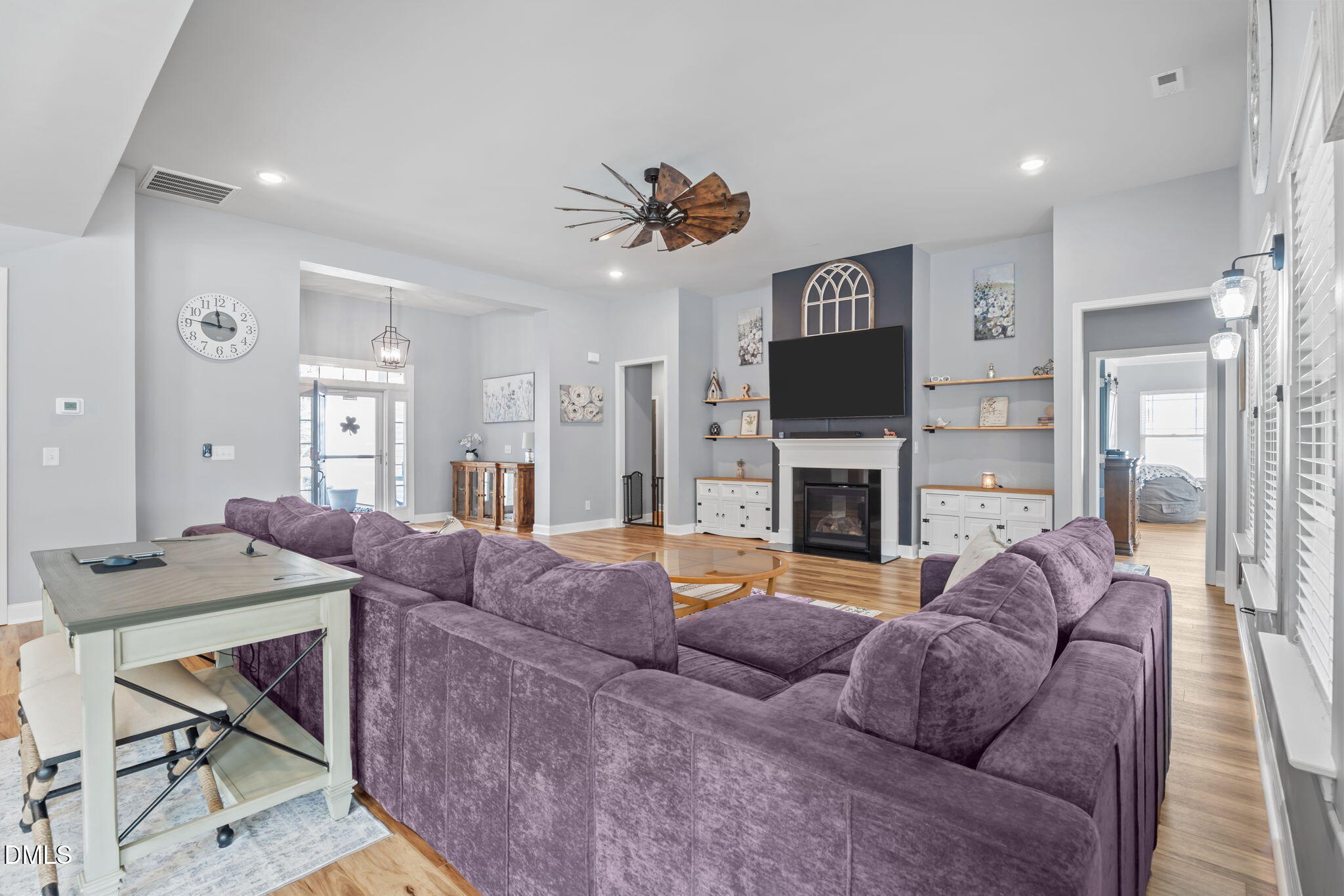9405 Whitley Road Bailey, NC 27807 - Photo 13 of 51 a living room with furniture a fireplace and a flat screen tv