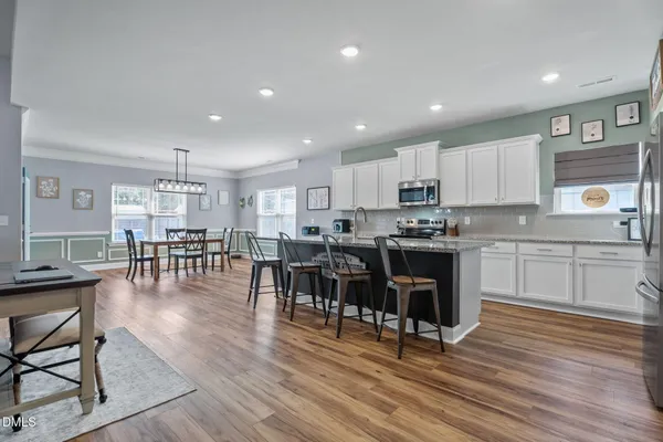 a kitchen with lots of counter top space and stainless steel appliances