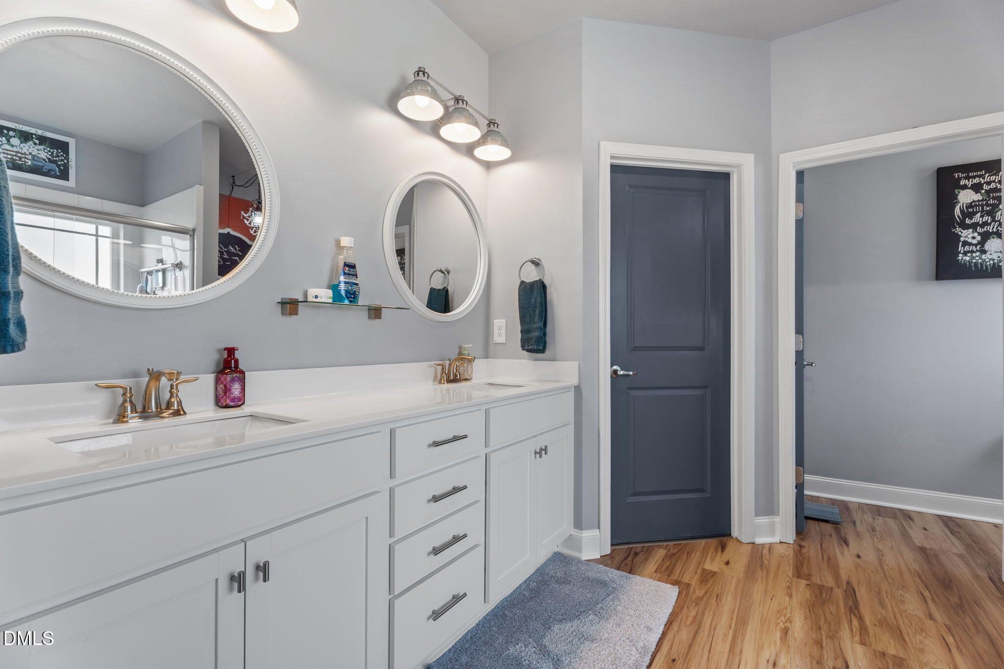 9405 Whitley Road Bailey, NC 27807 - Photo 25 of 51 a en suite bathroom with a double vanity sink and a mirror