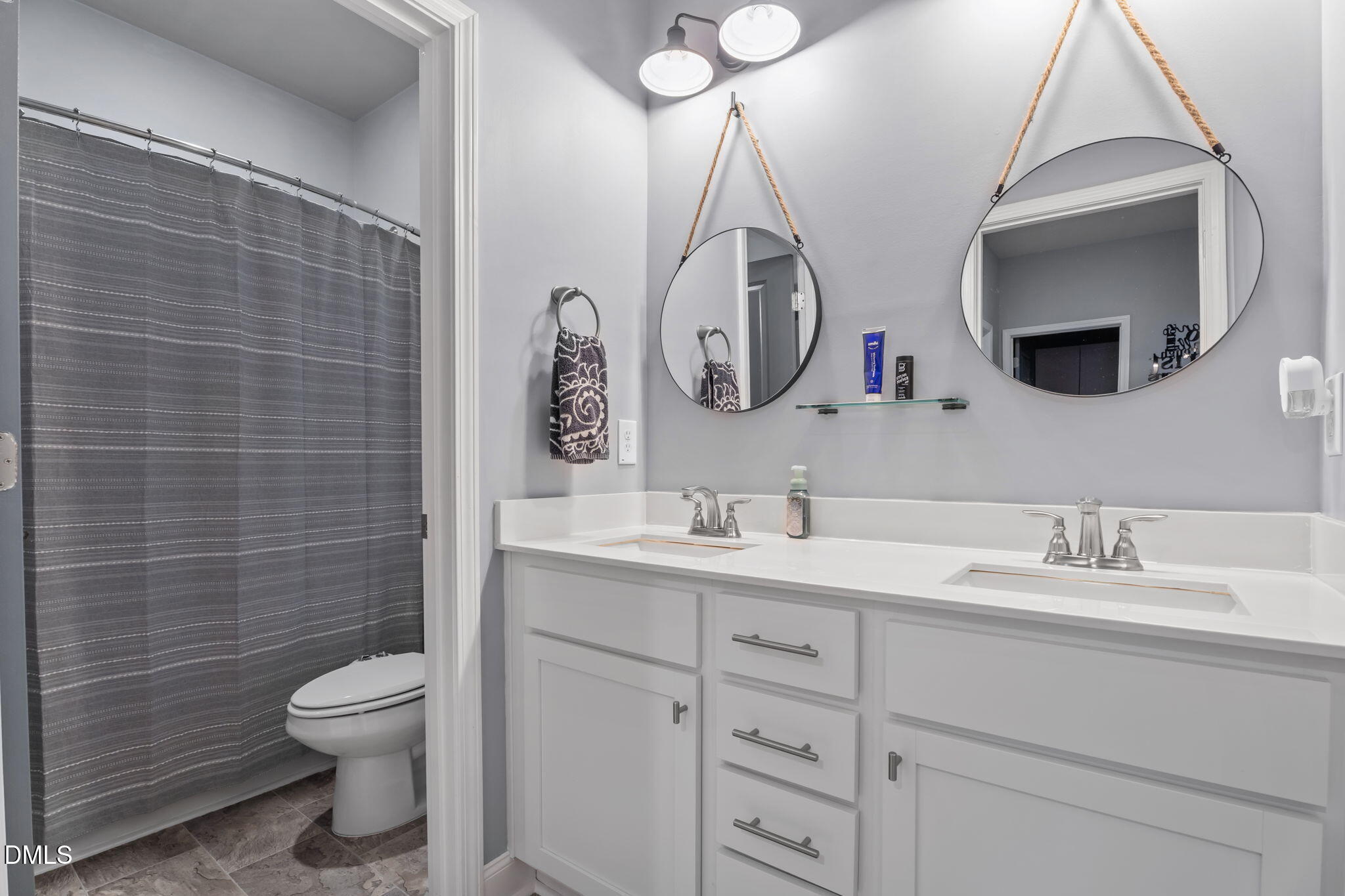 9405 Whitley Road Bailey, NC 27807 - Photo 29 of 51 a bathroom with a toilet sink and mirror
