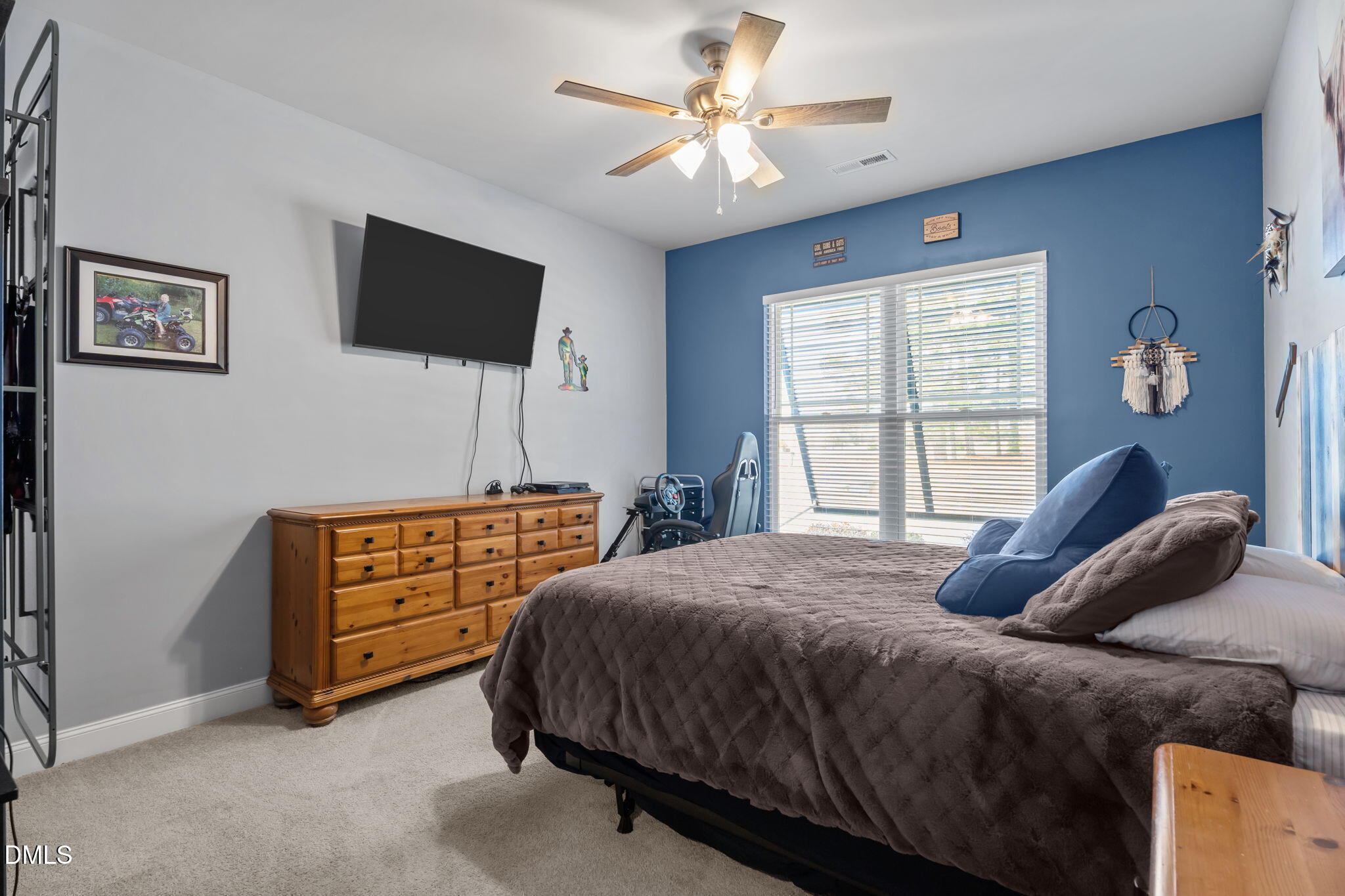 9405 Whitley Road Bailey, NC 27807 - Photo 30 of 51 a bedroom with a bed and a flat screen tv