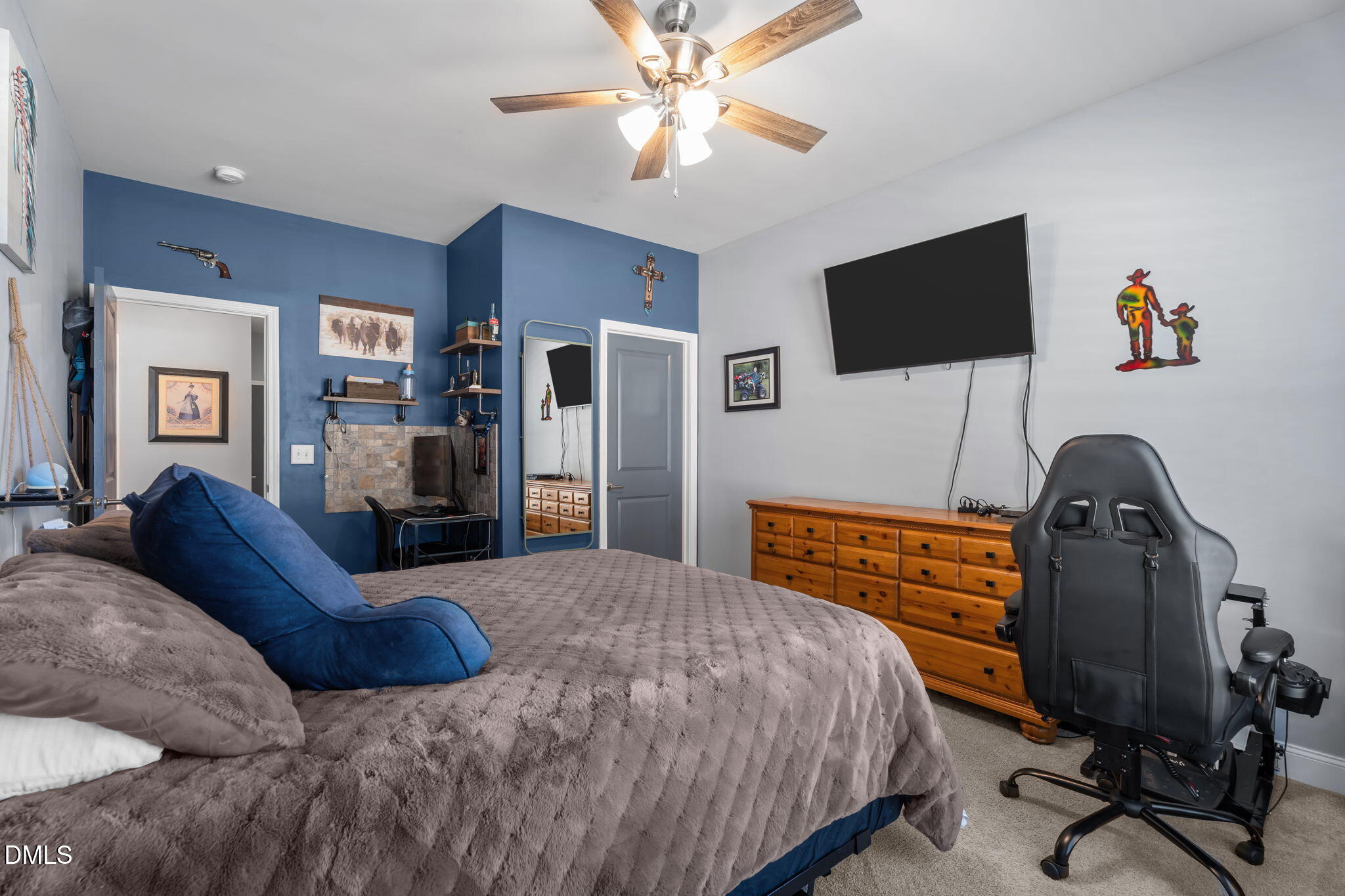 9405 Whitley Road Bailey, NC 27807 - Photo 31 of 51 a bedroom with a bed and a flat screen tv