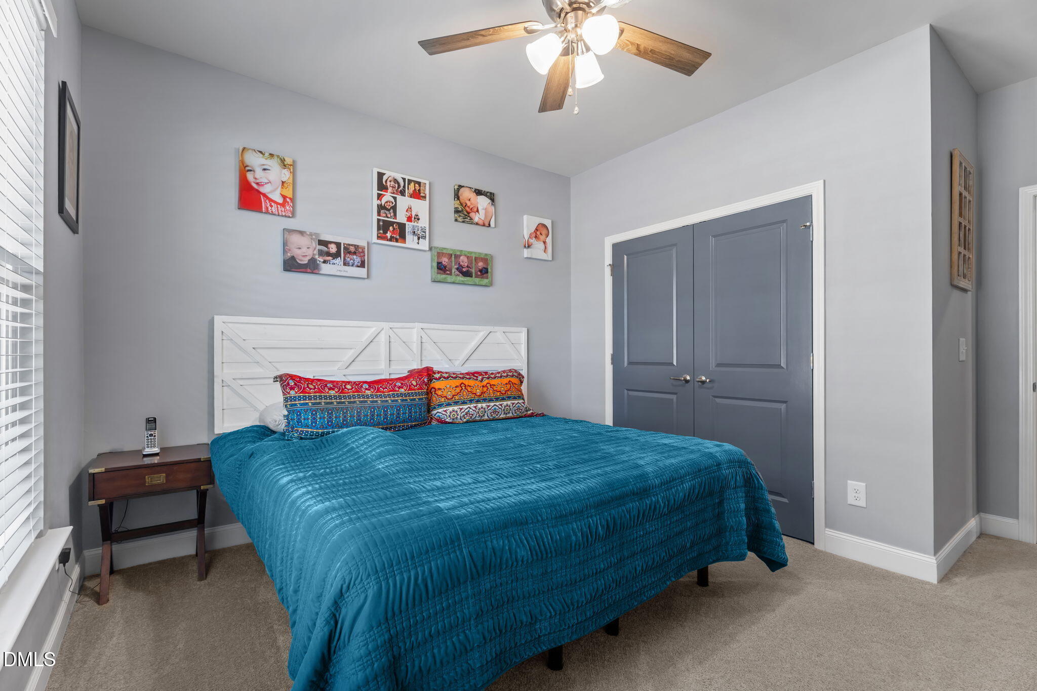9405 Whitley Road Bailey, NC 27807 - Photo 33 of 51 a bedroom with a bed and a chandelier