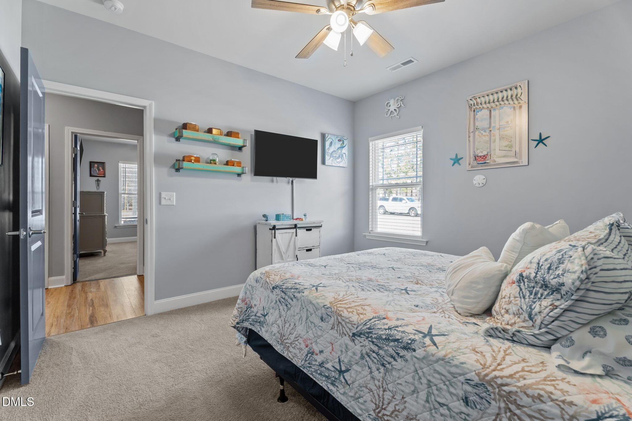9405 Whitley Road Bailey, NC 27807 - Photo 35 of 51 a bedroom with a bed and a flat tv screen on dresser