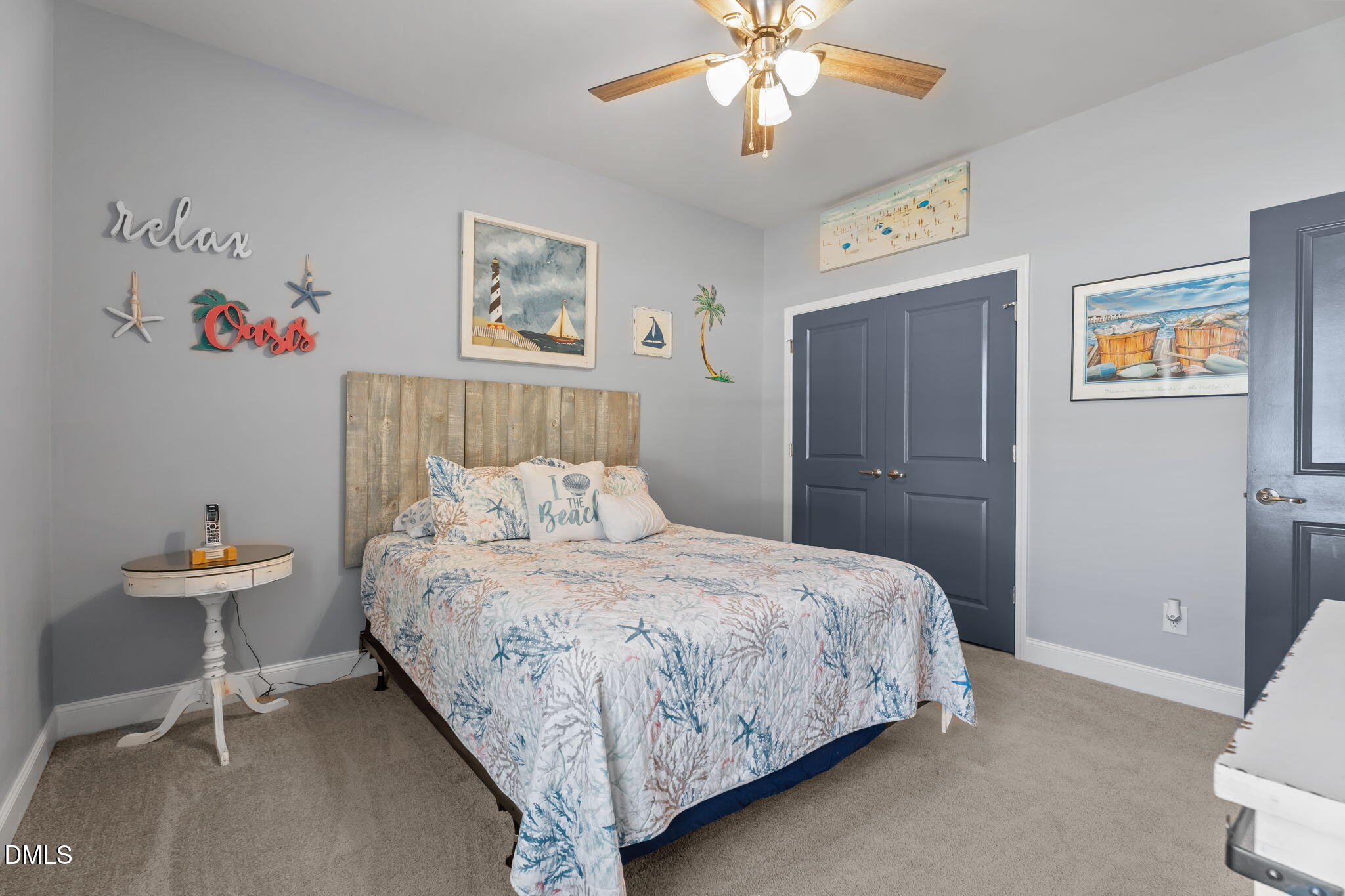 9405 Whitley Road Bailey, NC 27807 - Photo 37 of 51 a bedroom with a bed and a chandelier