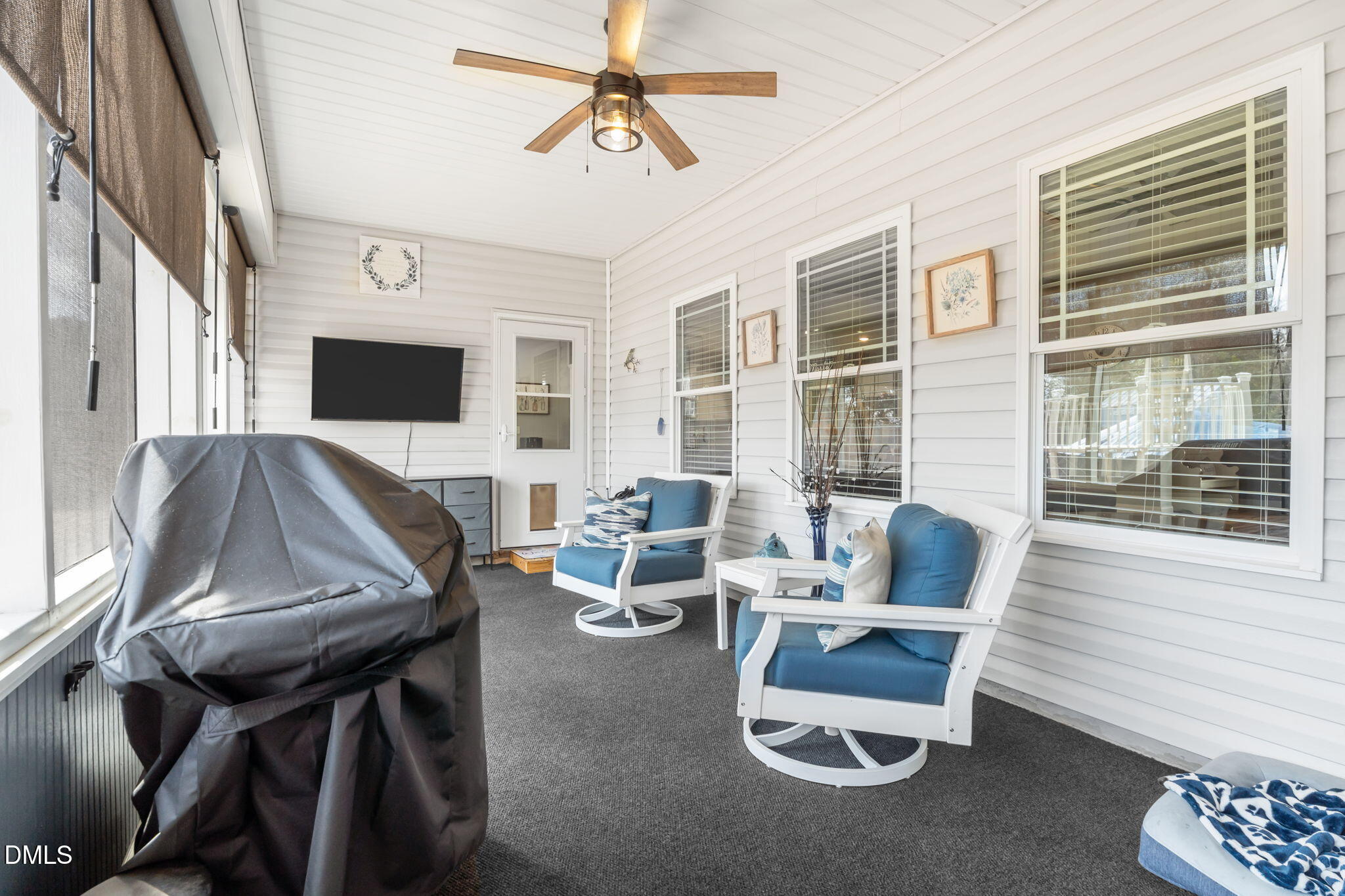 9405 Whitley Road Bailey, NC 27807 - Photo 39 of 51 a living room with furniture and a flat screen tv