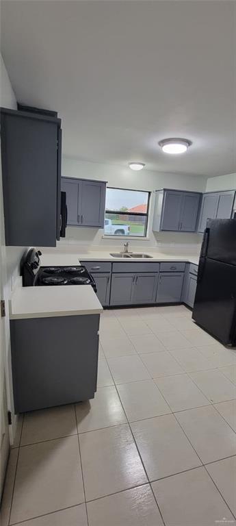 303 South Ridge Lane, Unit 1 San Juan, TX 78589 - Photo 2 of 6 a living room with a couch and a stove top oven