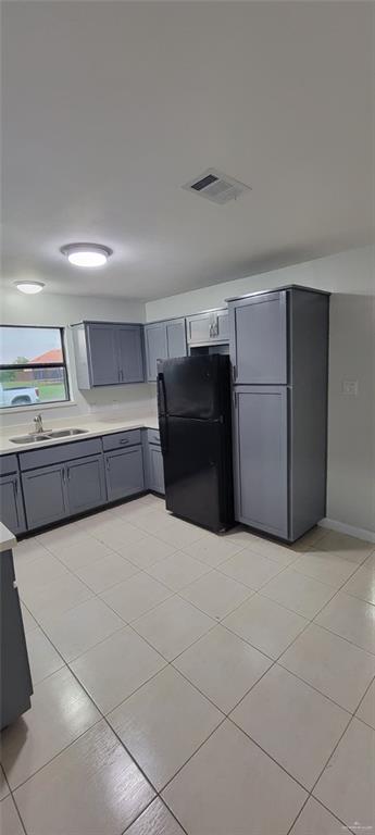 303 South Ridge Lane, Unit 1 San Juan, TX 78589 - Photo 3 of 6 a kitchen with a cabinets and a refrigerator