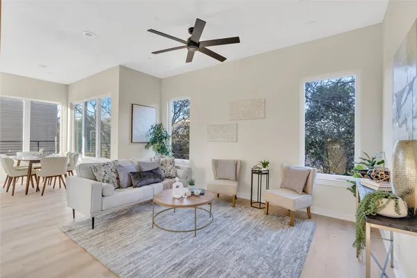 a living room with furniture and a large window