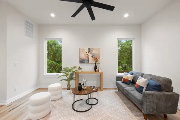 a living room with furniture and a large window