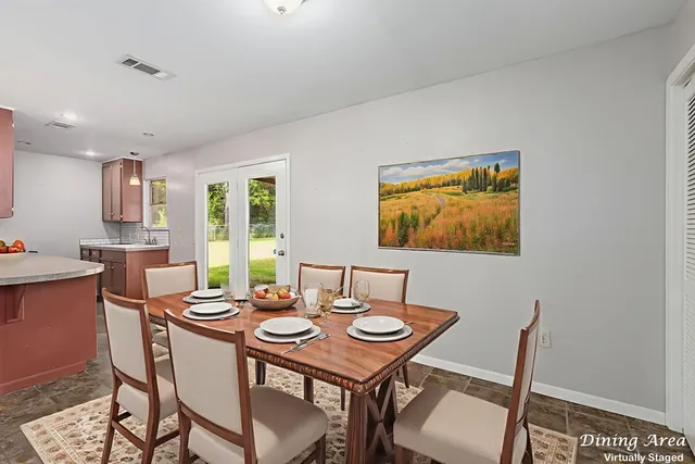 a dining room with furniture and window