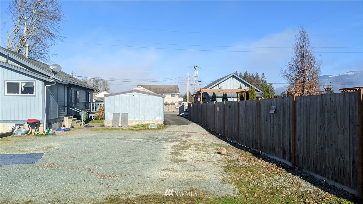 843 Cook Road Sedro-Woolley, WA 98284 - Photo 5 of 8 a view of a house with wooden fence