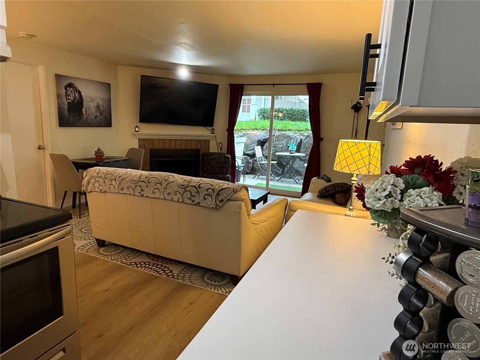 21301 52nd Avenue West, Unit B112 Mountlake Terrace, WA 98043 - Photo 8 of 17 a living room with furniture and a flat screen tv