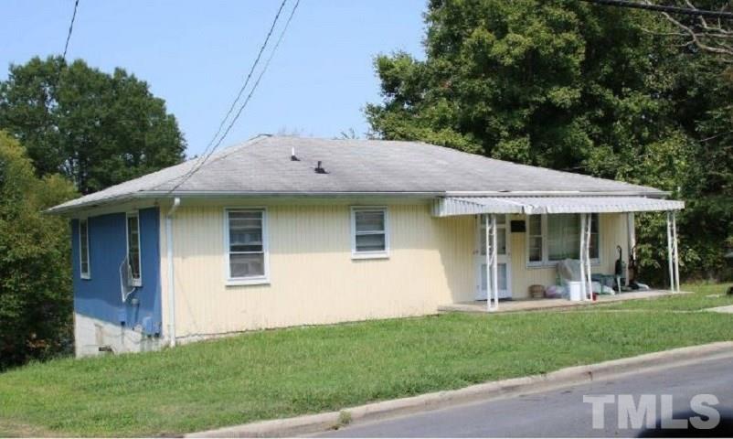 1208 South Roxboro Street Durham, NC 27707 - Photo 2 of 3 a view of a house with a yard potted plants and a table