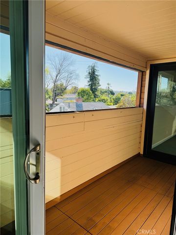 an empty room with large windows