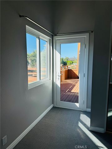 a view of a closet with wooden floor