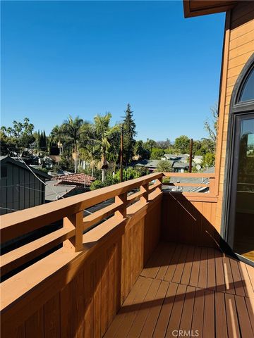 a view of balcony with wooden floor
