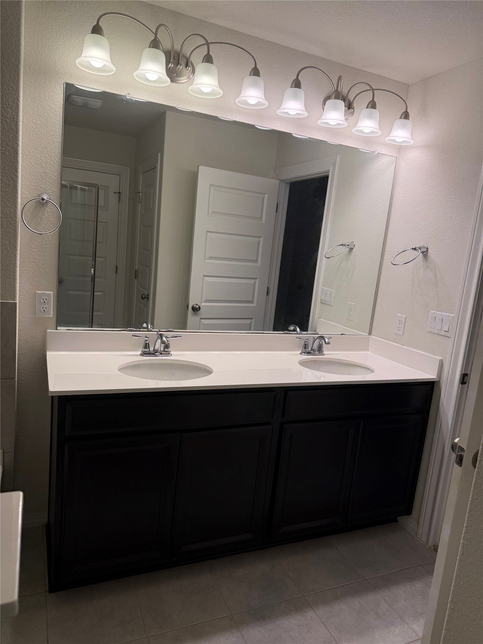 16109 Nightshade Street Austin, TX 78728 - Photo 12 of 24 a bathroom with a sink and a mirror