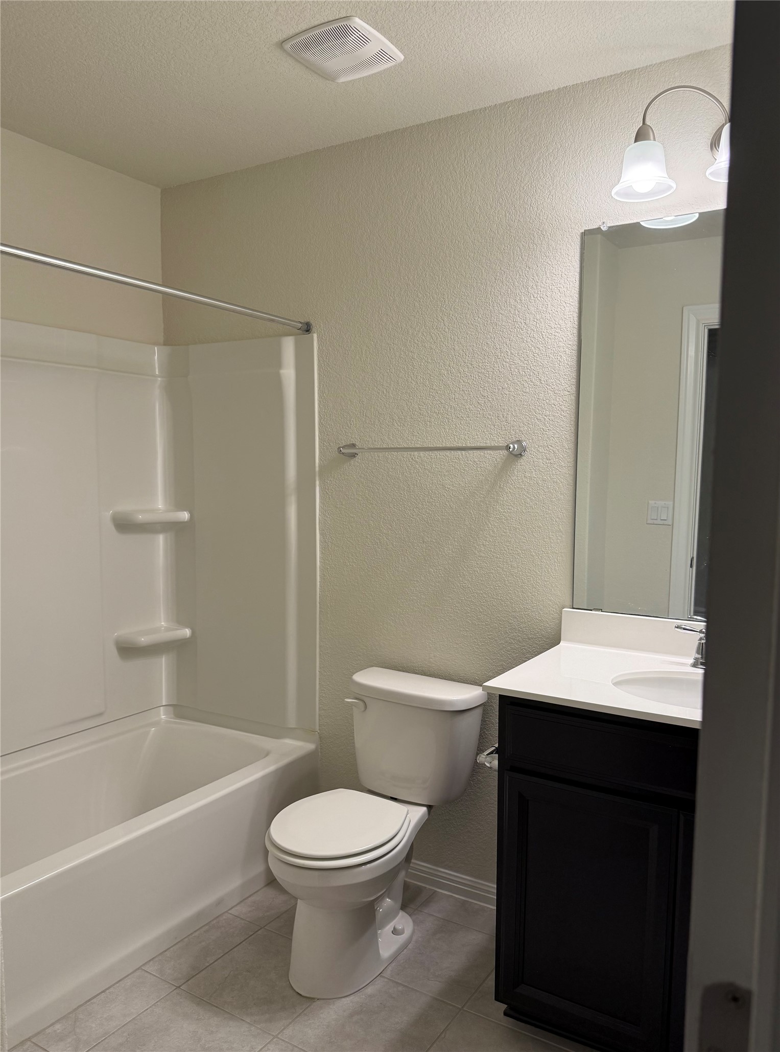 16109 Nightshade Street Austin, TX 78728 - Photo 16 of 24 a bathroom with a toilet a sink and a bathtub