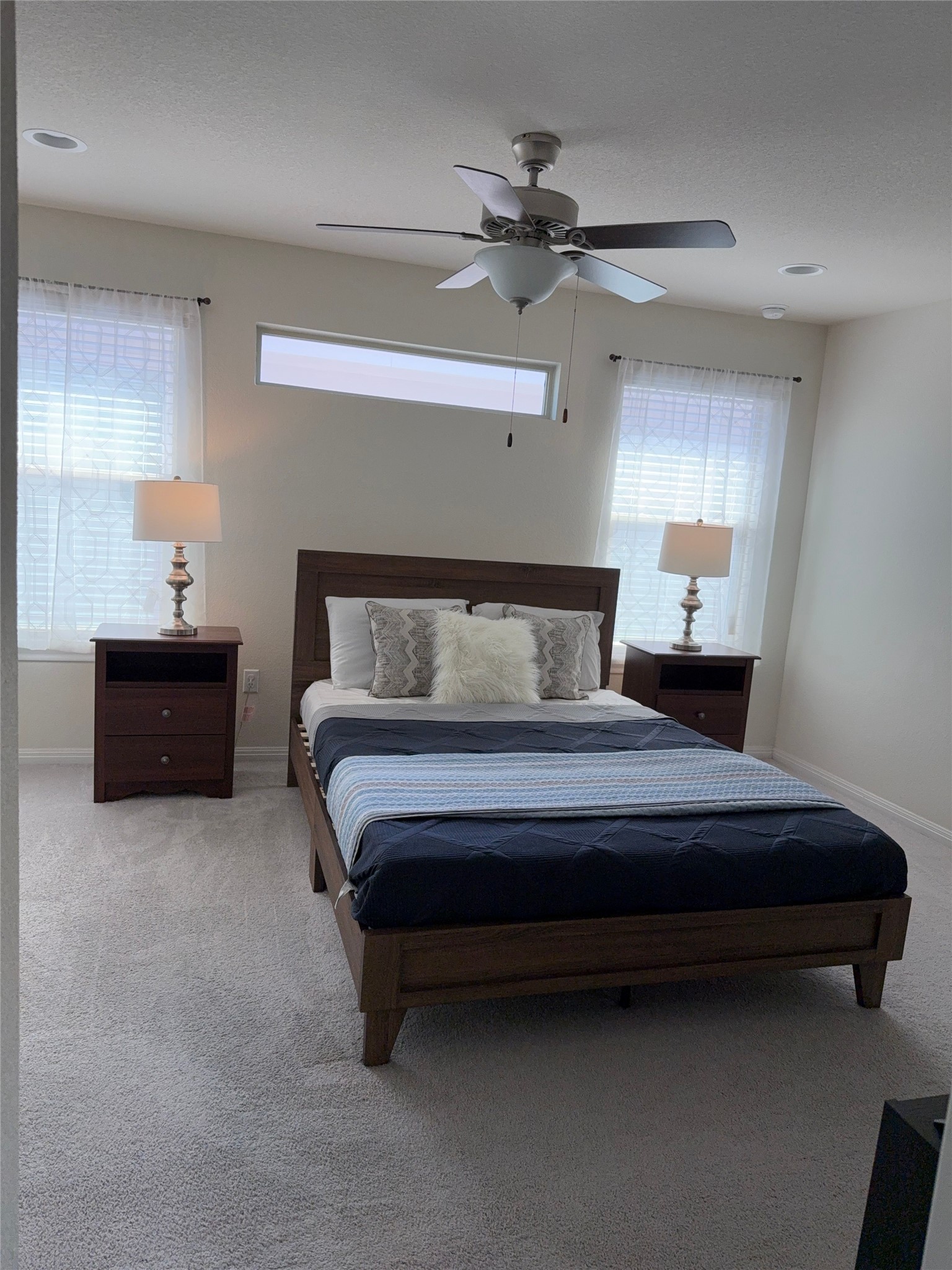 16109 Nightshade Street Austin, TX 78728 - Photo 10 of 24 a bedroom with a bed and window