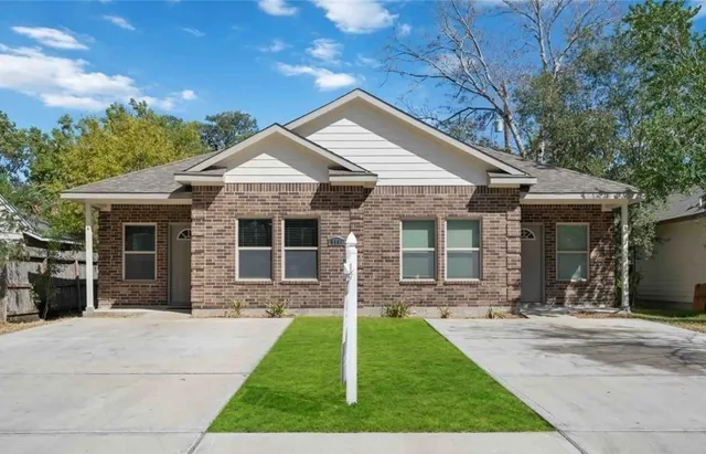 front view of a house with a yard