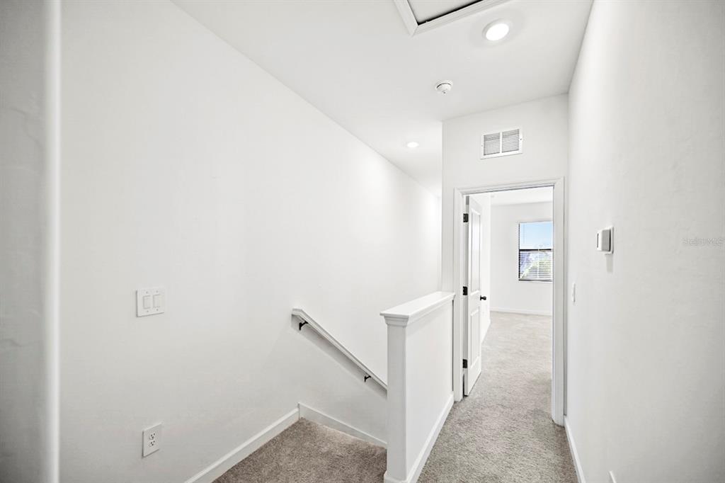 14812 Lyla Terrace Lakewood Ranch, FL 34211 - Photo 17 of 65 a view of a hallway with white walls