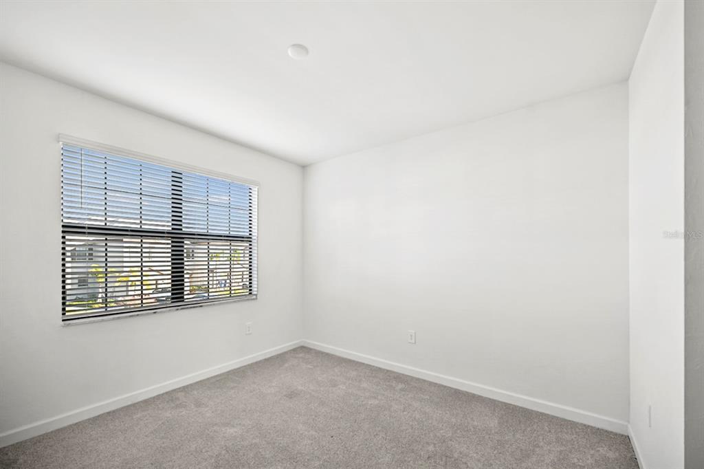 14812 Lyla Terrace Lakewood Ranch, FL 34211 - Photo 28 of 65 a view of an empty room with a window