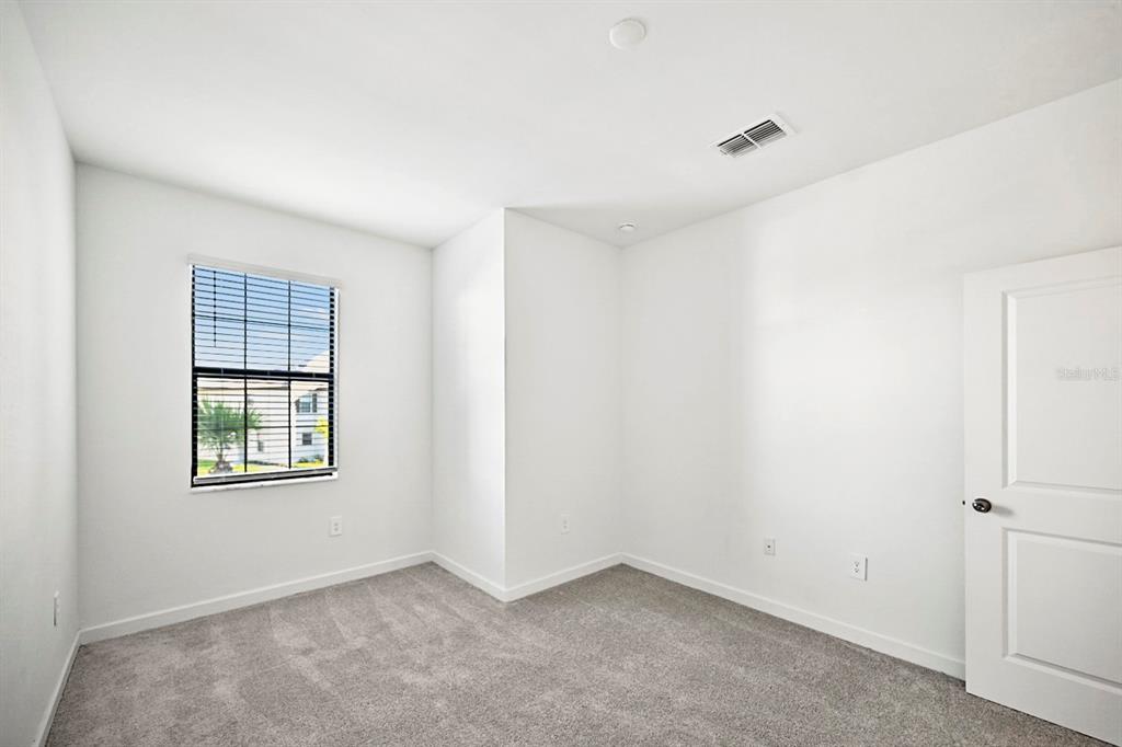 14812 Lyla Terrace Lakewood Ranch, FL 34211 - Photo 30 of 65 an empty room with windows and closet