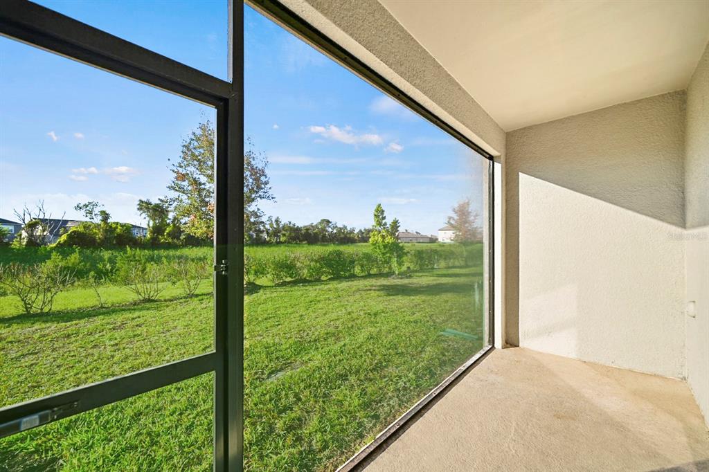 14812 Lyla Terrace Lakewood Ranch, FL 34211 - Photo 32 of 65 a view of a garden from a window