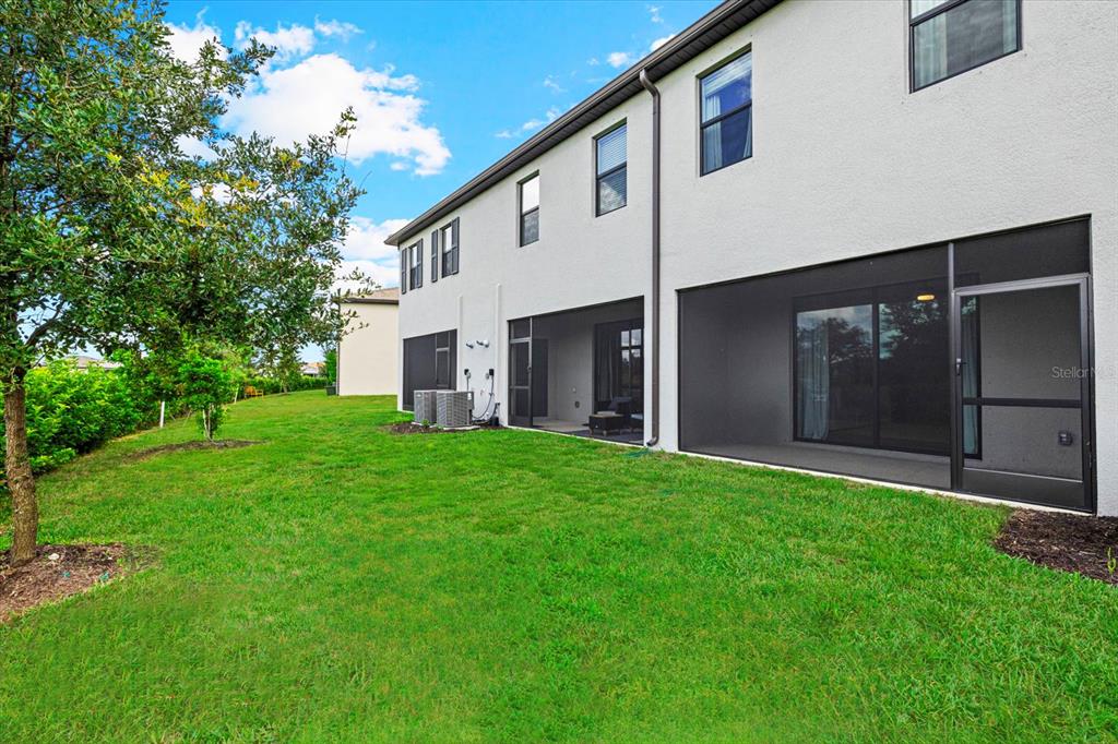 14812 Lyla Terrace Lakewood Ranch, FL 34211 - Photo 33 of 65 a view of a back yard of the house
