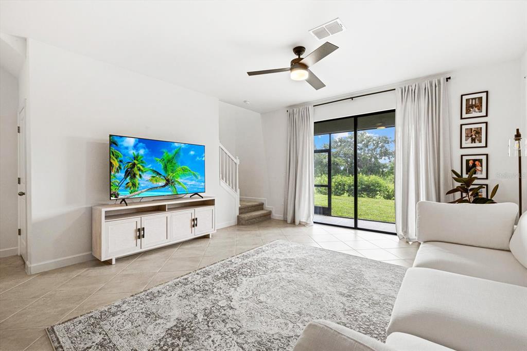 14812 Lyla Terrace Lakewood Ranch, FL 34211 - Photo 4 of 65 a view of living room with furniture and a flat screen tv