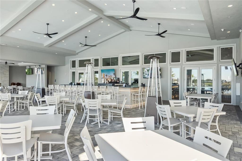 14812 Lyla Terrace Lakewood Ranch, FL 34211 - Photo 41 of 65 a view of a dining room with furniture window and outside view
