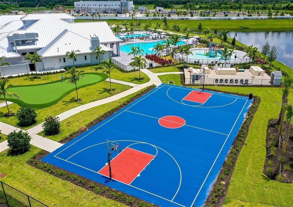 14812 Lyla Terrace Lakewood Ranch, FL 34211 - Photo 47 of 65 an aerial view of a pool and chairs