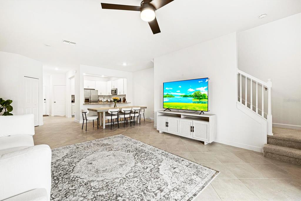 14812 Lyla Terrace Lakewood Ranch, FL 34211 - Photo 6 of 65 a living room with furniture and a flat screen tv