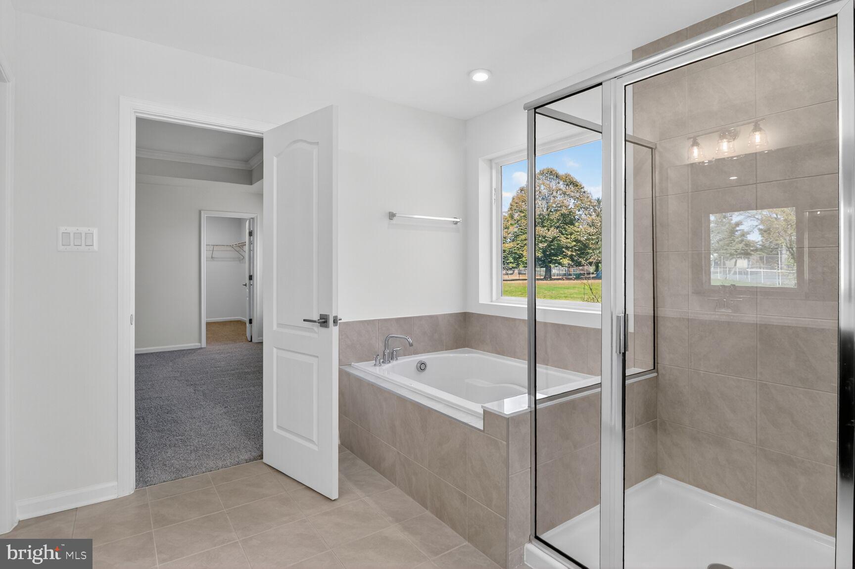 4016 Millner Road Nottingham, MD 21236 - Photo 13 of 15 a bathroom with a tub and shower