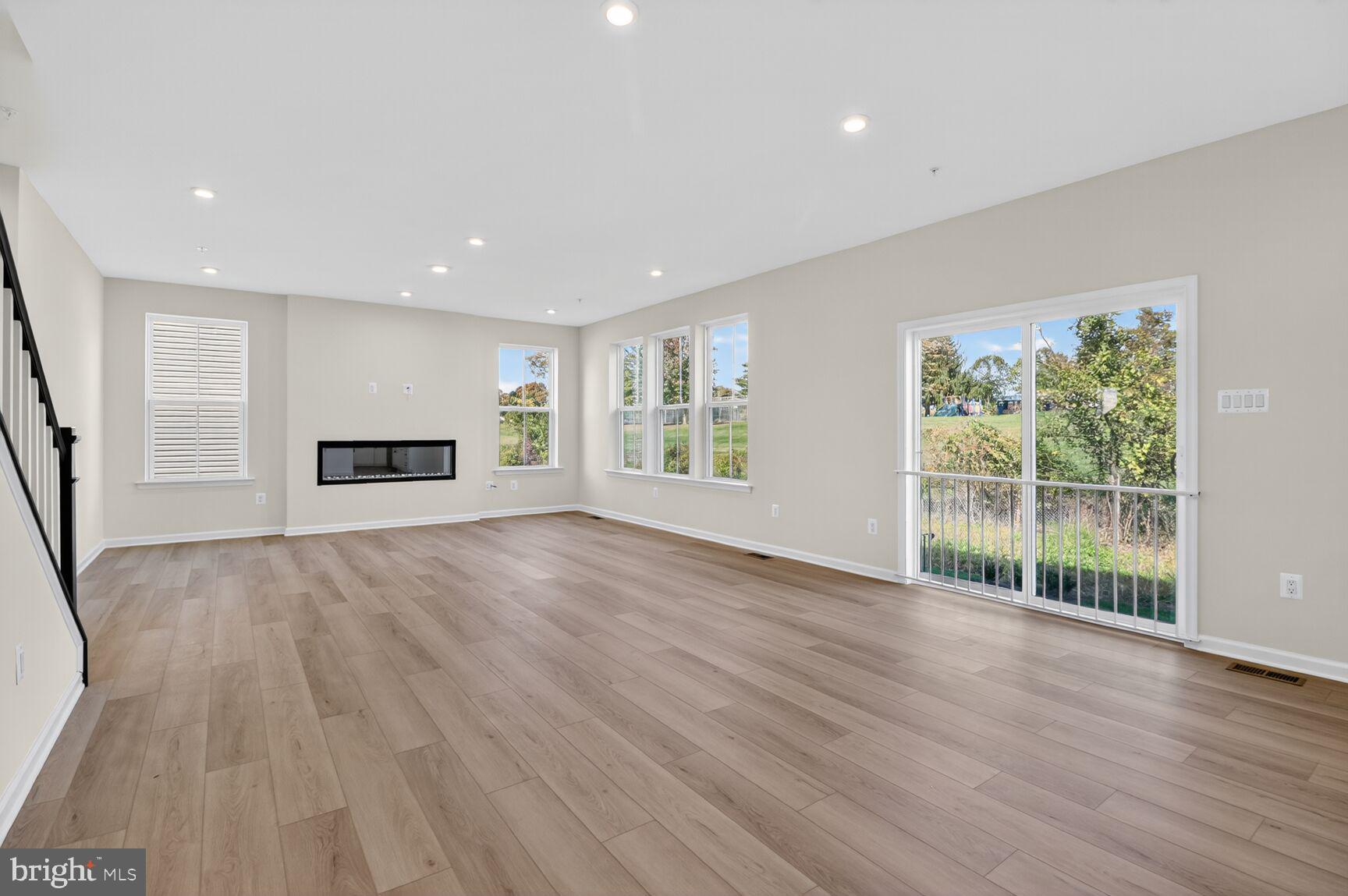 4016 Millner Road Nottingham, MD 21236 - Photo 9 of 15 a view of empty room with wooden floor and fan
