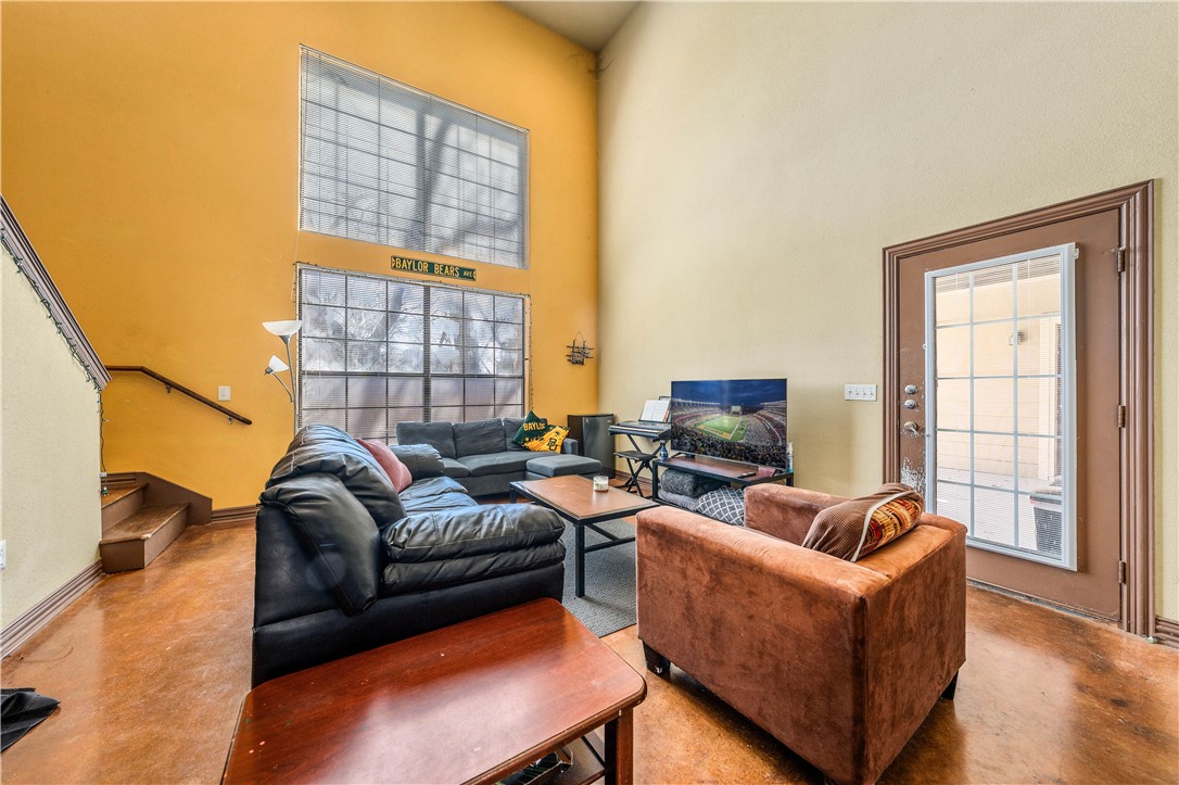 2410 2nd Street South Waco, TX 76706 - Photo 13 of 36 a living room with furniture a flat screen tv and a large window