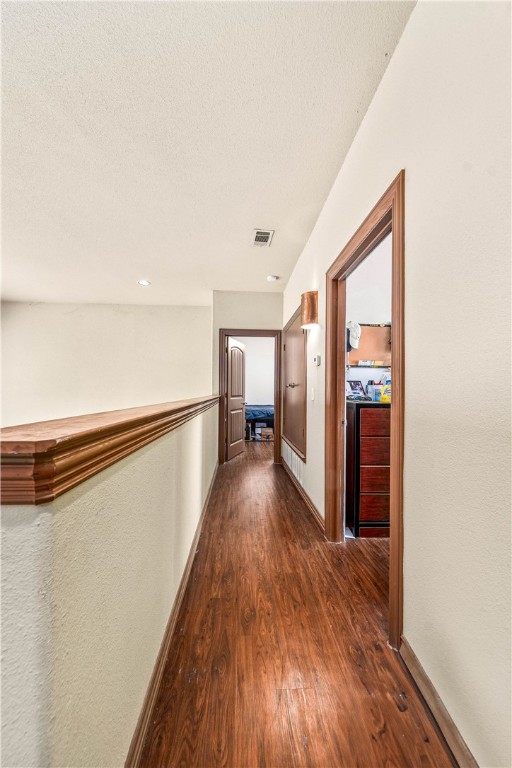 2410 2nd Street South Waco, TX 76706 - Photo 23 of 36 a view of a hallway with wooden floor and staircase
