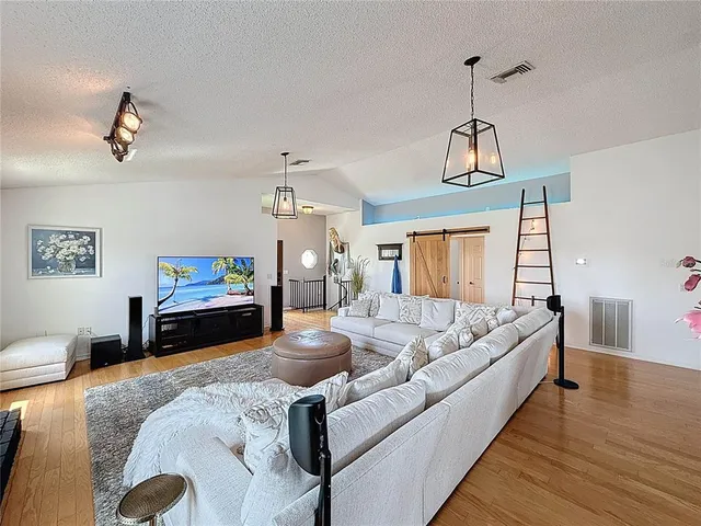 a room with furniture and pool table