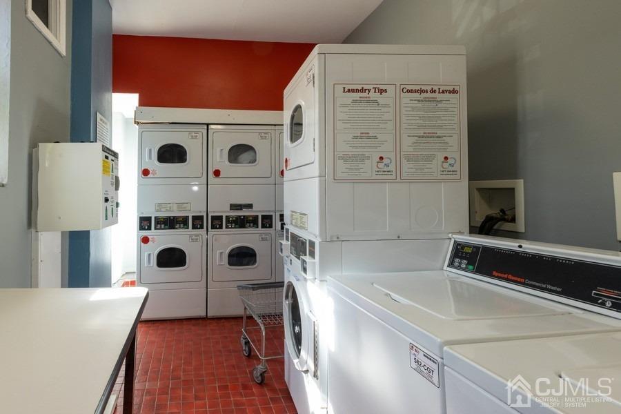 400 Deal Lake Drive, Unit 4G Asbury Park, NJ 07712 - Photo 20 of 20 a bathroom with a sink a mirror and a shower