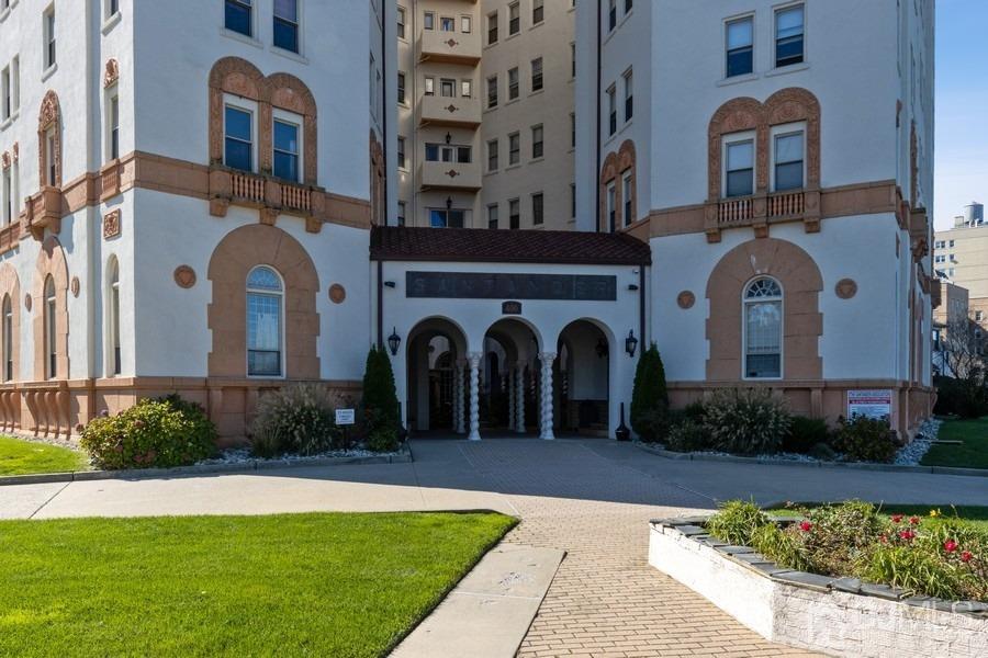400 Deal Lake Drive, Unit 4G Asbury Park, NJ 07712 - Photo 3 of 20 a front view of a house with a garden